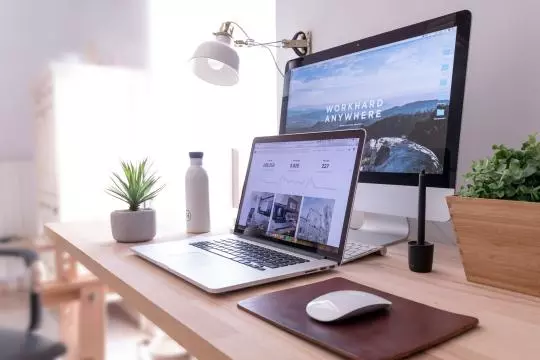 Laptop and PC setup on a desk