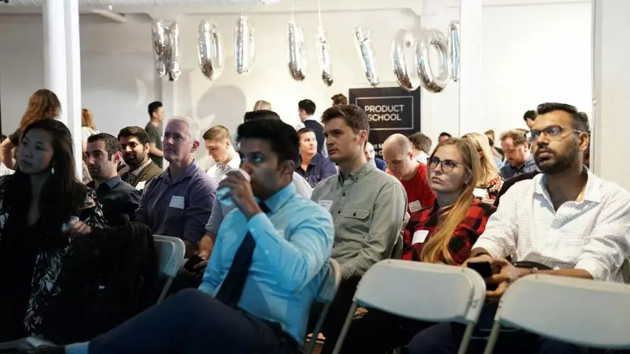 People sat down at a conference