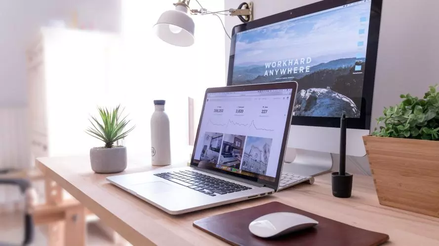 Laptop and PC setup on a desk