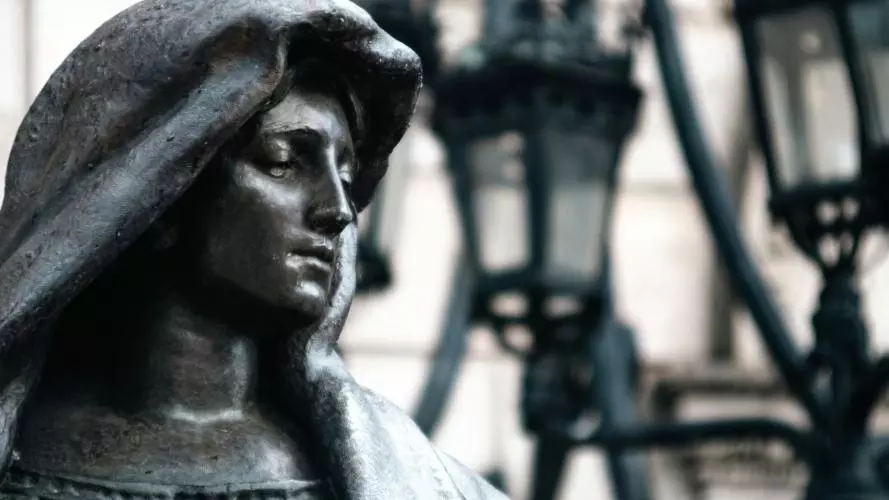 statue of a woman in a hood