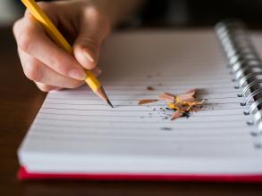 Pencil writing in a notepad